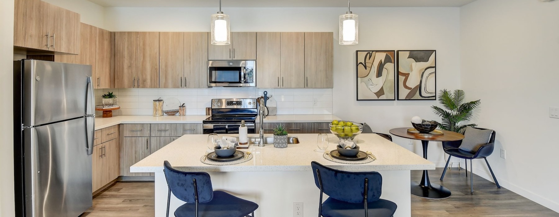 a kitchen with a dining table and chairs