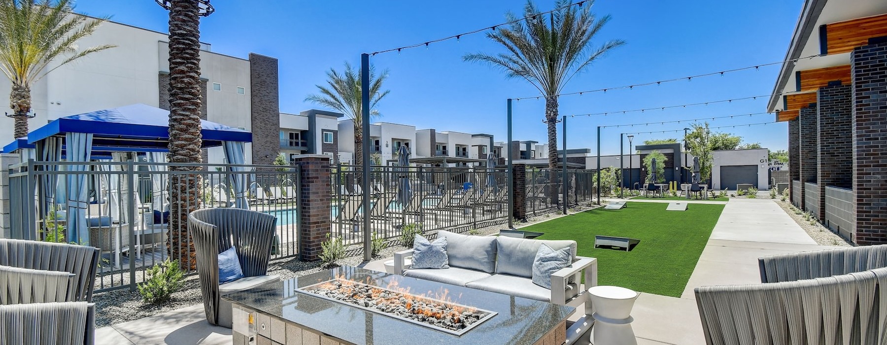 a firepit with chairs and a couch